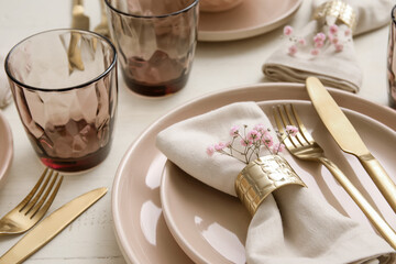 Set of stylish tableware on table