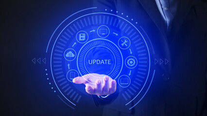 Businesswoman using virtual screen with word UPDATE on dark background