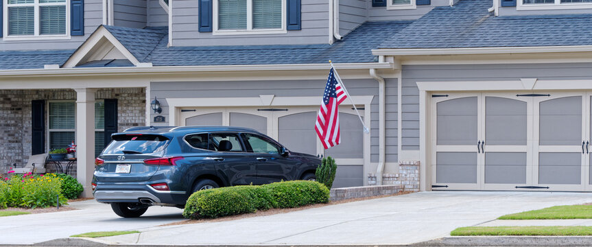 Over 55 Condo With American Flag And SUV