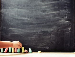 back to school background with blackboard and chalks