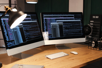 Modern workplace of programmer with computers