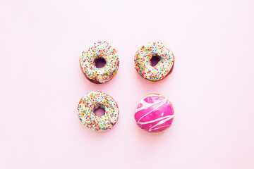 fresh donats over bright pastel background 