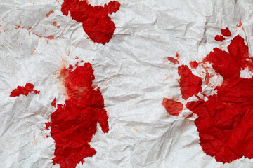 Blood on a crumpled napkin. Close up.