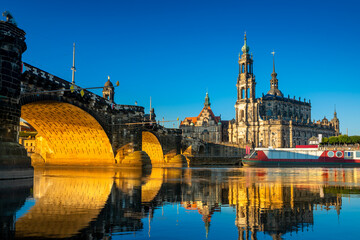 Augustus Bridge and Cathedral of the Holy Trinity with reflections in the river Elbe. Dresden, Saxony, Germany