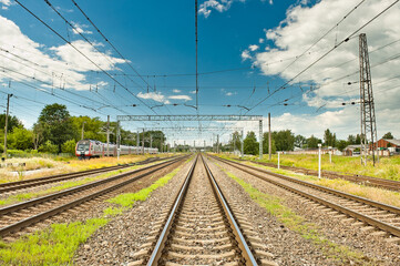 railway against the blue sky and clouds - obrazy, fototapety, plakaty