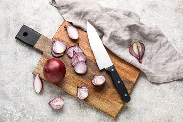 Composition with wooden board of red onion and knife on grunge background - Powered by Adobe