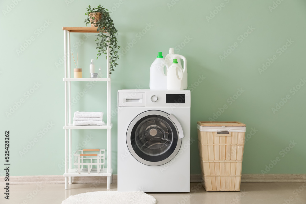 Canvas Prints Interior of stylish laundry room with washing machine, shelving unit and basket