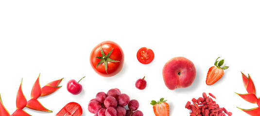 Creative layout made of red fruits and vegetables on the white background. Flat lay. Food concept. Macro  concept.Tomato,grape,cherry tomato,strawberry,goji berry,cherry on the white background.