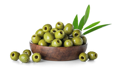 Wooden bowl with delicious green olives on white background
