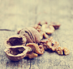 various types of nuts closeup over wooden background 