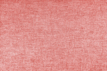 Texture of natural red upholstery fabric or cloth. Fabric texture of natural cotton or linen textile material. Blue canvas background. Decorative fabric for curtain, furniture, walls, clothes