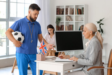 Obraz premium Teachers working in school office