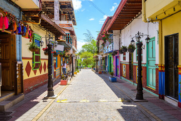 colorful street of guatape colonial town, colombia - obrazy, fototapety, plakaty
