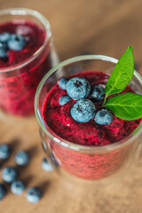 Fresh juicy blueberry smoothies in the glass. Simple background. Healthy food. Detox. Lifestyle