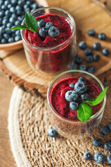 Fresh juicy blueberry smoothies in the glass. Simple background. Healthy food. Detox. Lifestyle