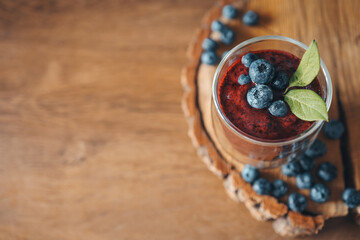 Fresh juicy blueberry smoothies in the glass. Simple background. Healthy food. Detox. Lifestyle