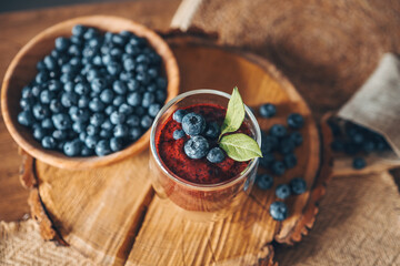 Fresh juicy blueberry smoothies in the glass. Simple background. Healthy food. Detox. Lifestyle