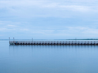 Fototapeta na wymiar Fishing pier at the bay
