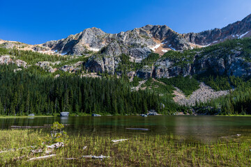 serene Cutthroat Lake in North cascade national park under a clear blue sky in Washington State.