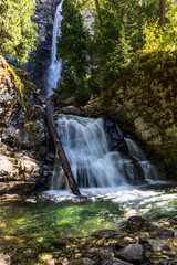 Obraz premium majestic Rainbow waterfall in Stehekin in Lake Chelan National Recreation Area in North Cascade national Park in washington during summer