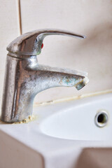 Rusted faucet, macro shot of rusted faucet. Water scarcity and water consumption concept idea.