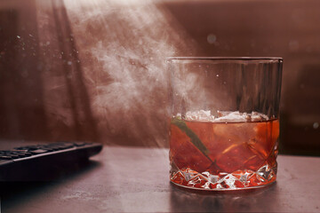 A classic whiskey drink in a glass with ice.