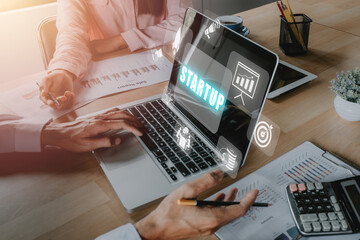 Startup business concept, Business team analyzing income charts and graphs with icons startup on VR...