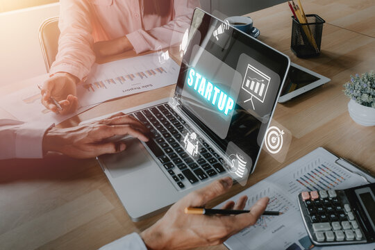 Startup business concept, Business team analyzing income charts and graphs with icons startup on VR screen.