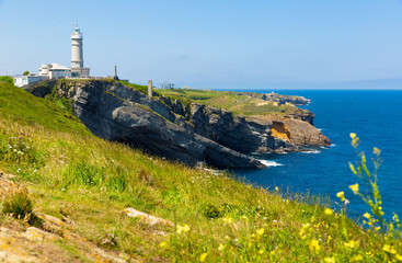 Fototapeta na wymiar Scenic view of rocky Atlantic coast of cape Mayor with lighthouse in sunny summer day, Santander, Spain..