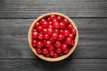 Ripe fresh cranberry on grey wooden table, top view