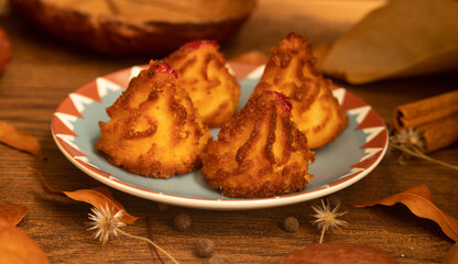 Traditional coconut dessert of the autumn and Christmas season, known as coconut bites, coconut candy, baked coconut and mini coconut sighs