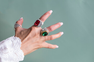 close up of a hand holding a jewel. Jewelry