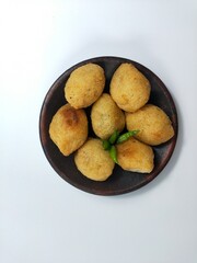 Comro or Combro is a typical Sundanese fried food, West Java, Indonesia. Comro or Combro is made from grated cassava which is shaped round or oval and filled with chili oncom and then fried.