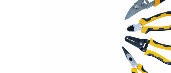 different type of yellow and black pliers hand tools flat lay isolated white background with copy space 