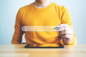 Searching information data on internet networking concept. Hand of businessman touching magnifying...