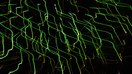 花火を特殊撮影した緑色の電子回路の光のイメージ素材