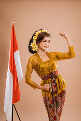 excited woman with balinese traditional kebaya costume over isolated background