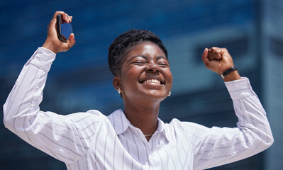 Winner, celebration and black woman in business happy after winning a corporate achievement outside...