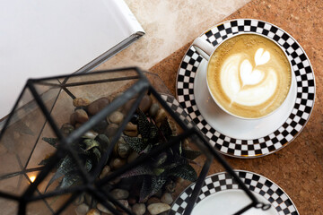 top view of Hot fresh latte coffee on wooden table background