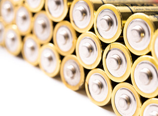 Closeup of positive ends of discharged batteries AA sizes, selective focus. Used alkaline battery. Hazardous garbage concept
