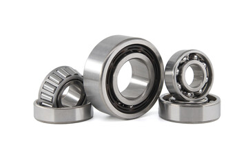 Set of various ball and roller bearings on white