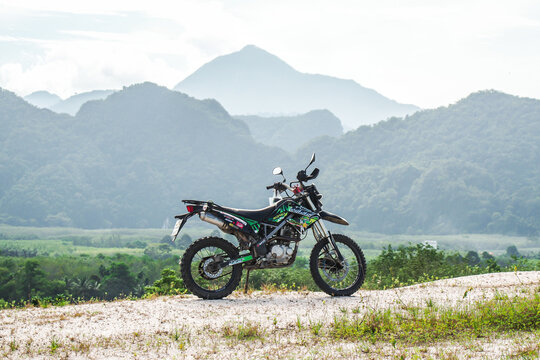 Motorcycle Kawasaki DTK125 Motocross of tourists parked on the mountain beautifully on September 24, 2022, Ban Na San District Surat Thani Province, Thailand