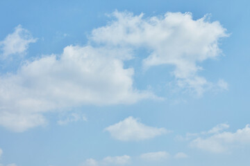 Naklejka na ściany i meble Blue sky texture with white clouds for background