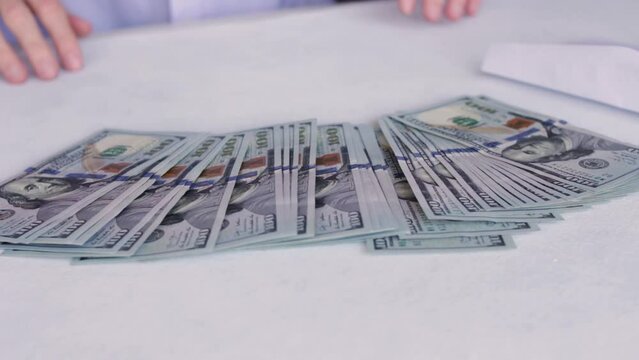 Stack Of New One Hundred US Dollar Bills From White Envelope. close up