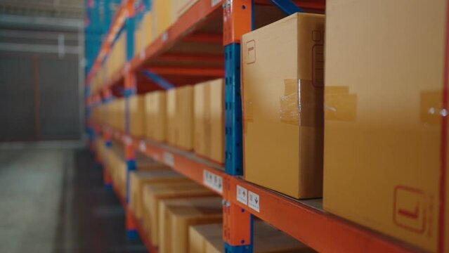 Close up of rows of shelves with goods boxes in industry warehouse store at the factory warehouse storage.