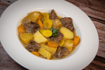 Recipe for beer and mustard beef chuck stew with potatoes, turnips and carrots, High quality photo