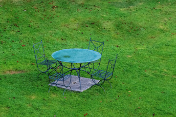 vintage table and chairs in a park