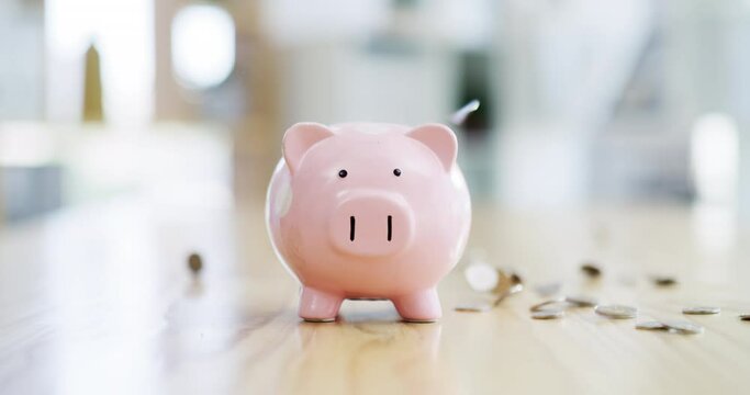 Piggy bank, financial and budget savings with cash or change, for investment and growth. Finance, success and invest in economy trading with money coins landing on table future planning
