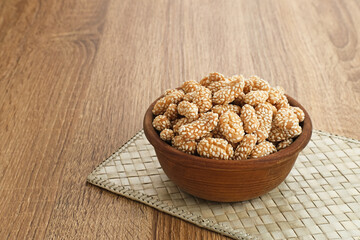Kue Keciput, Indonesian traditional snack made from glutinous rice flour, eggs, sugar and sprinkled with sesame seed.

