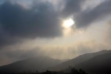 time lapse of clouds over mountains
